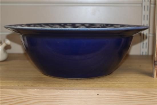 A 19th century Chinese white slip decorated blue ground basin diameter 34cm